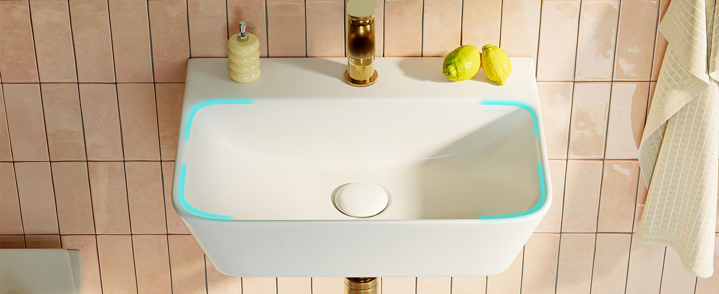 Lavabo da bagno rettangolare moderno con bordo a luce LED blu, incastonato in un piano di lavoro bianco con sfondo a parete piastrellato rosa