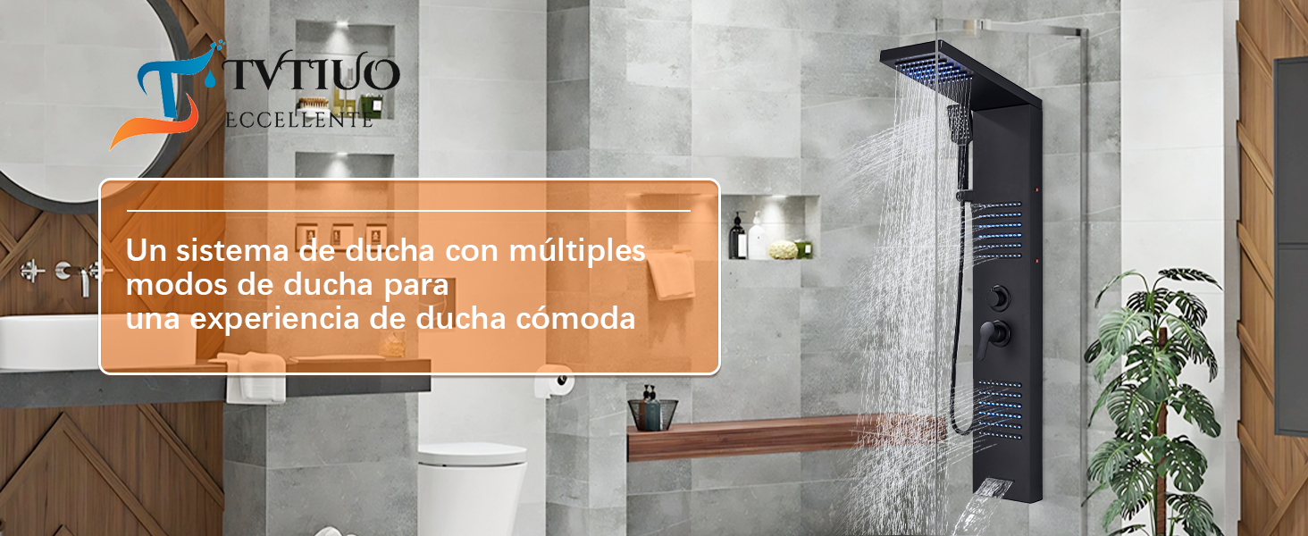 Moderno sistema de paneles de ducha negros montado en una pared de azulejos grises, con múltiples modos de rociado y pantalla digital, con plantas de interior visibles.