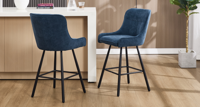Multiple views of a modern accent chair with navy blue upholstery and black metal legs, showing different angles of the curved backrest and padded seat.
