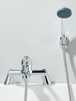 Chrome bathroom fixture set showing a mounted faucet with drain tray and handheld shower head with flexible metal hose on white background.