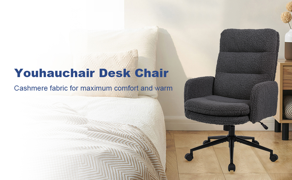 Gray upholstered office chair with high back, armrests, and five-wheel base. Features tufted cushioning and cashmere fabric for comfort. Positioned next to a white bed.
