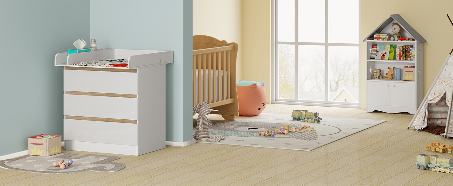Nursery room with white dresser, wooden crib, colorful rug, and bookshelf.
