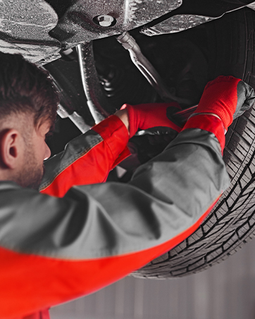 a man working on a car tire