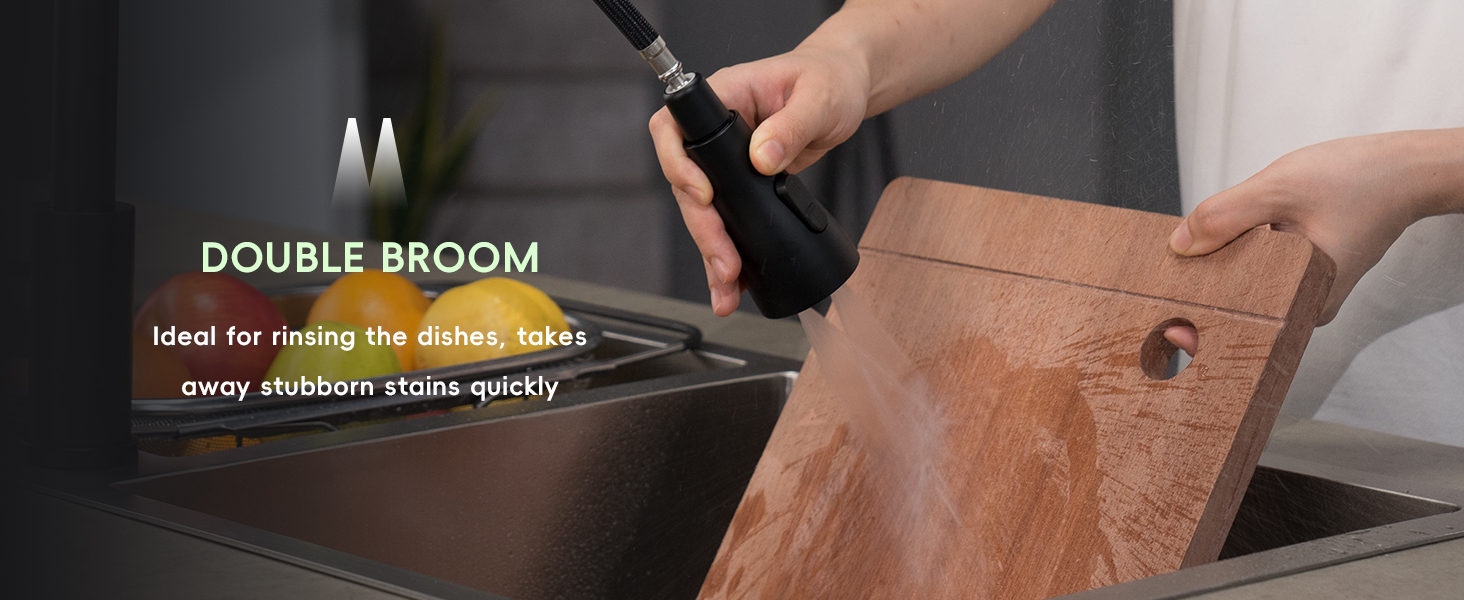 Double broom tool with two metal prongs cleaning grout between tiles. Text describes it as ideal for rinsing dishes and removing stubborn stains quickly.