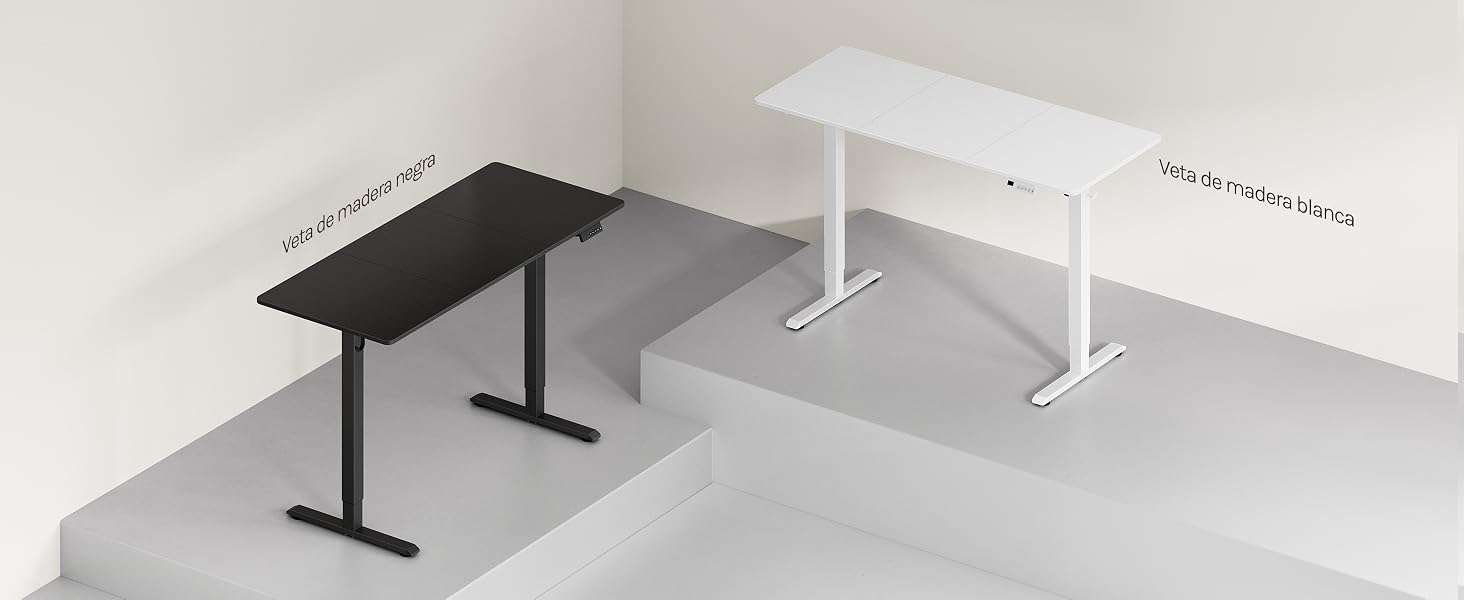 Se muestran dos mesas de escritorio plegables, una modelo en negro y otra en blanco, desde un ángulo elevado, que muestran un tamaño compacto y una estructura de metal sobre una superficie gris.