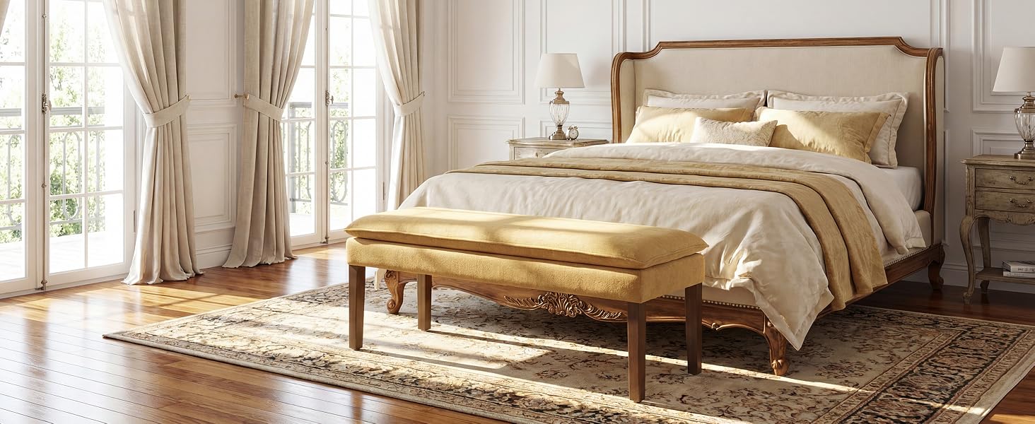 Luxury bedroom interior featuring an ornate canopy bed with flowing white curtains, elegant furniture, and plush carpeting in a well-lit room.