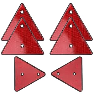 Set of four red reflective triangular warning signs with mounting holes, arranged in two rows showing identical triangles.
