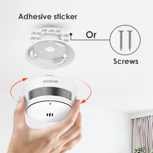 Schéma d'installation montrant les options de montage d'un appareil circulaire avec autocollant adhésif ou vis, y compris les flèches de rotation et les composants d'installation.
