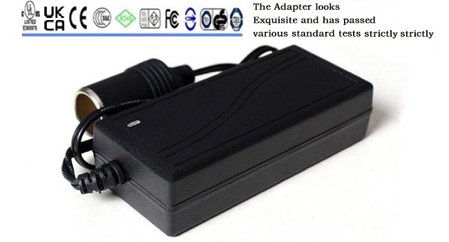 a black charger with a black power cord.