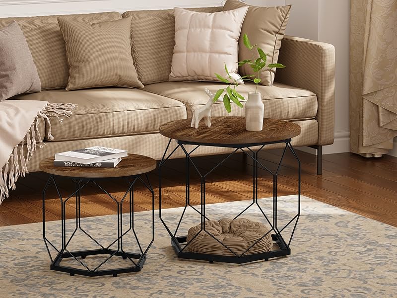 Set of geometric nesting coffee tables with black metal wire frames and wooden tops, arranged in front of a beige sofa.
