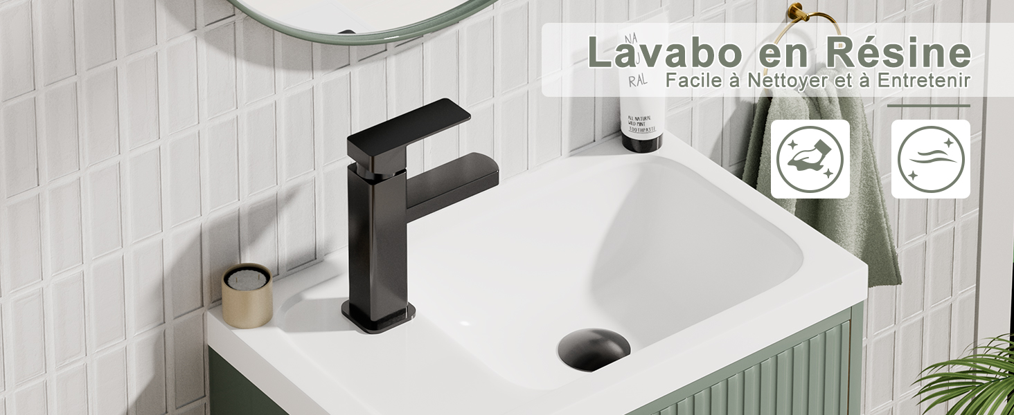 Lavabo de salle de bain moderne en résine blanche avec robinet noir mat.