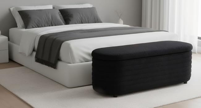 Modern minimalist living room featuring a transforming sofa bed in dark gray, shown in various positions from sofa to bed configuration.