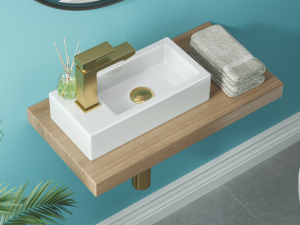Modern white ceramic bathroom sink mounted on wooden shelf against turquoise wall. Minimalist design with clean lines and natural wood accents.
