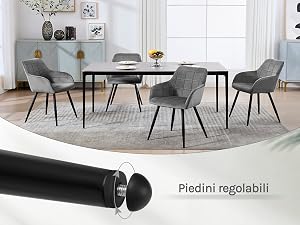 Set da pranzo moderno con tavolo ovale nero e quattro sedie imbottite grigie su un tappeto rotondo. Il testo menziona 'Piedini regolabili' (piedini regolabili