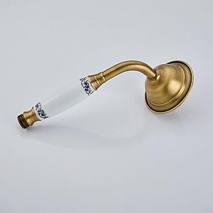 un robinet de salle de bain en laiton avec poignée en verre