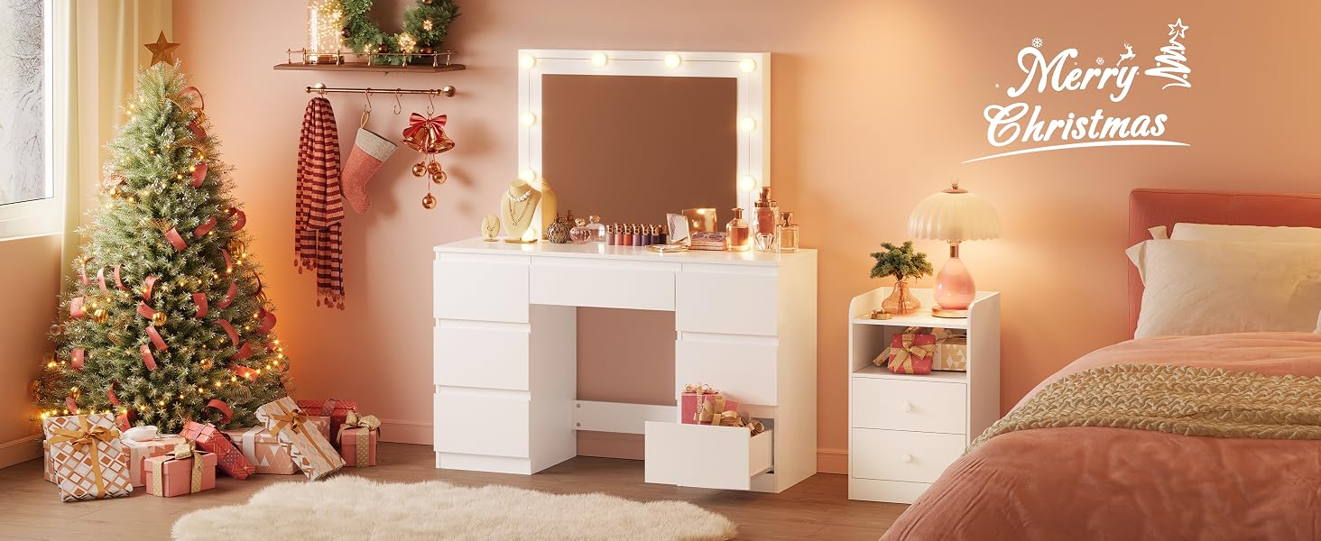 a white vanity with a mirror and lights on it.