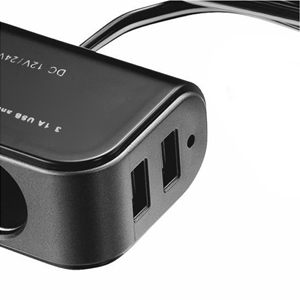 Black electronic device with multiple USB ports and a round power outlet. Compact design with curved edges and a short cable attached.