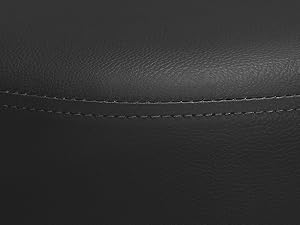 Dark textured surface or material shown in low lighting conditions.