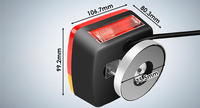 Technical diagram of a black and red device with circular metal component, showing dimensions: 106.7mm x 80.3mm x 92.2mm with 75.8mm disc.