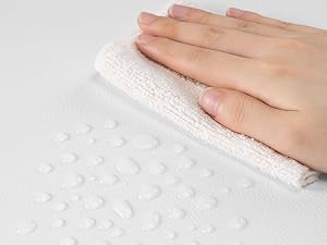 Close-up sequence showing hands touching white textured fabric or material, demonstrating surface pattern or material quality.