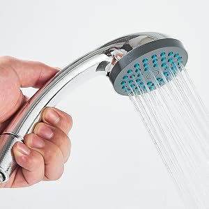 Chrome handheld showerhead with blue nozzles spraying water, demonstrating spray pattern functionality.