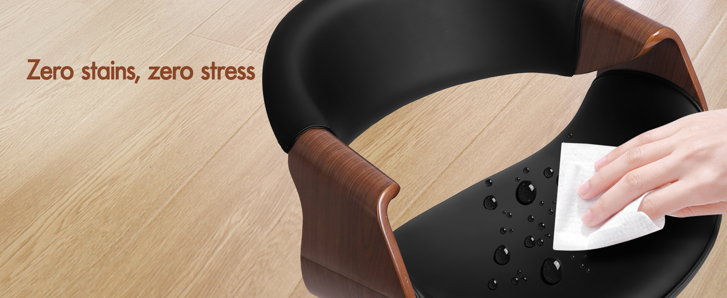Text reads 'Zero stains, zero stress'. Product demonstration showing dark-colored cleaning device on wooden flooring.