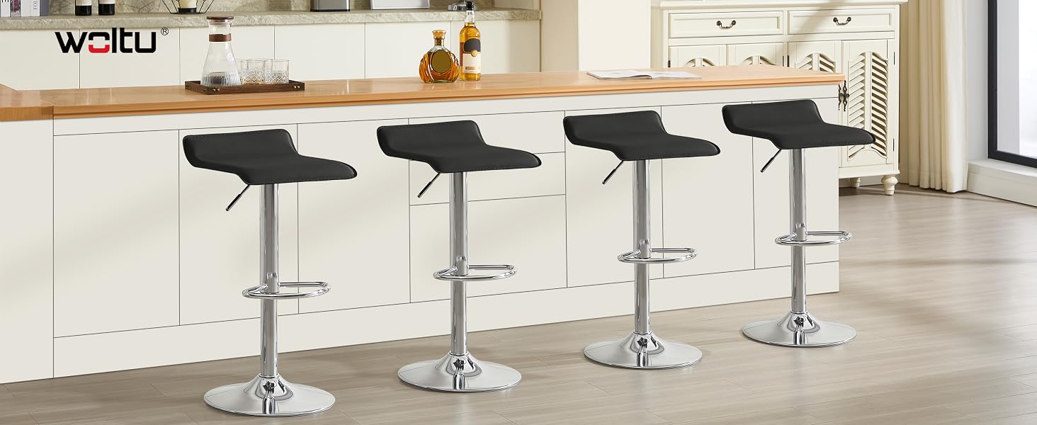 Four adjustable black bar stools with curved seats and footrests, positioned along a kitchen counter. The stools have chrome bases and stem supports for height adjustment.