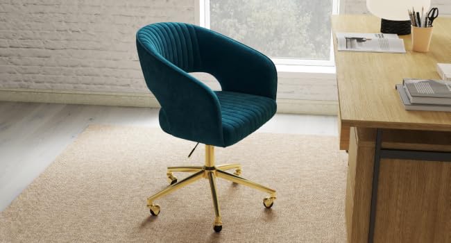 Teal velvet office chair with curved back and arms.