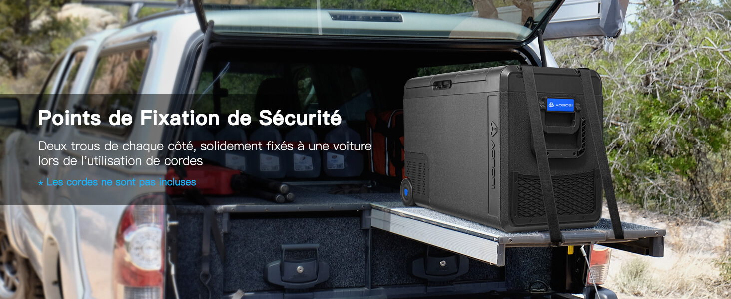 Système de rangement pour véhicules montrant les points de fixation de sécurité installés dans la caisse du camion, avec boîtier de protection et matériel visibles.