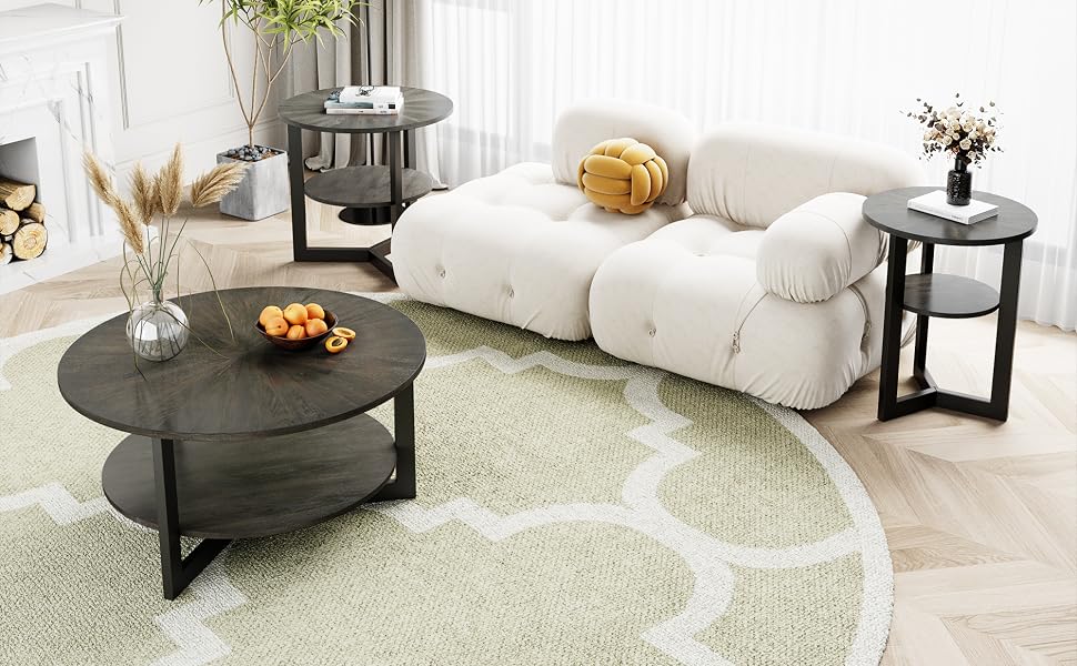 Modern living room with white modular sofa, circular rug, black coffee tables, and side tables. Decor includes plants, vases, and wall art.