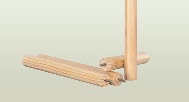 Natural wood dowels and connectors arranged on pale green background, showing assembly components for furniture or craft projects.