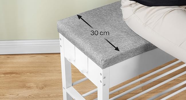 Il testo dice «30 cm». Cuscino o cuscino da seduta rettangolare grigio posizionato sul giroletto bianco con misure che indicano una larghezza di 30 cm.