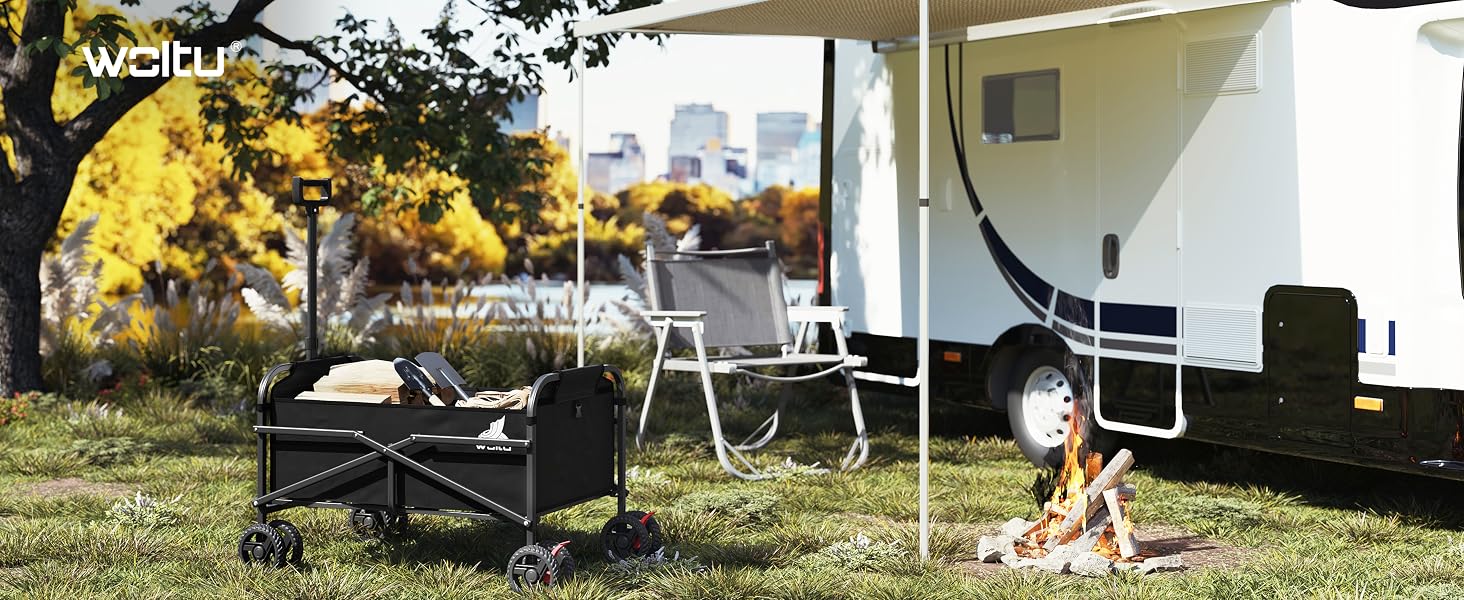 Outdoor camping setup with black chairs, table, and campfire near an RV or trailer, trees visible in background.