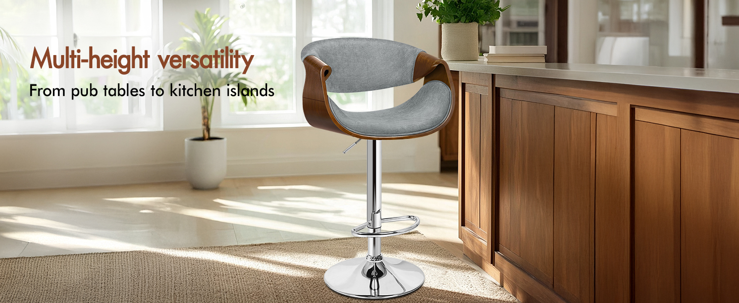 Text reads 'Multi-height versatility'. Modern adjustable bar stool with gray upholstery shown in kitchen setting with wooden cabinets.