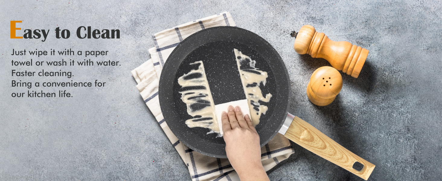Démonstration d'une surface facile à nettoyer. Essuyer à la main la surface circulaire foncée avec une serviette en papier. Le texte décrit le processus de nettoyage rapide. Salière et ustensile de cuisine visibles