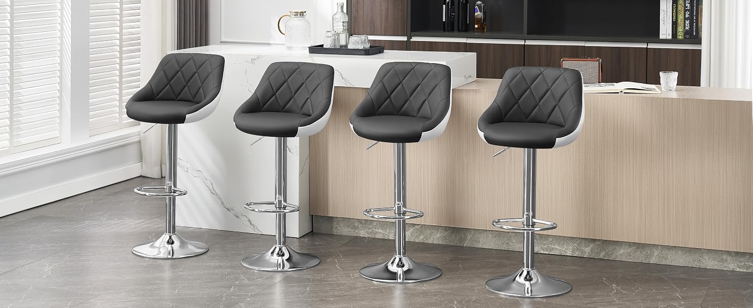 the bar stools are made of stainless steel with a black leather seat.