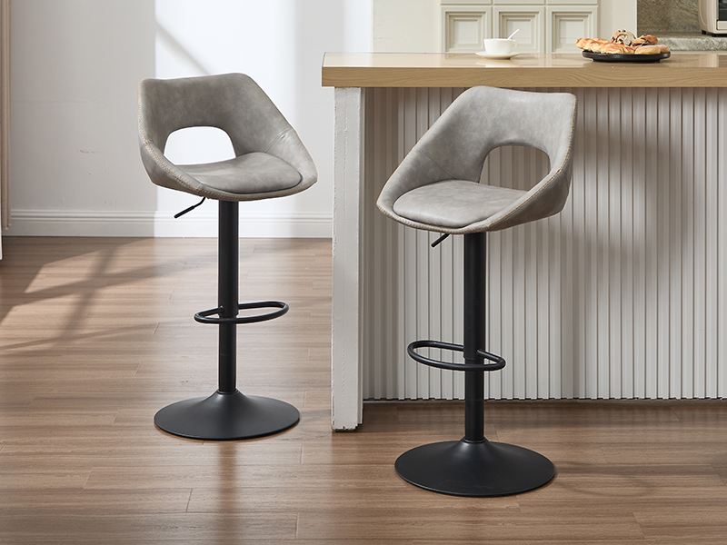 Modern bar stools with curved gray upholstery and black base shown in various angles in a kitchen setting with wooden flooring.