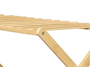 Wooden folding rack or shelf with slatted design. Multiple parallel wooden bars connected by a folding mechanism, shown partially extended against white background.