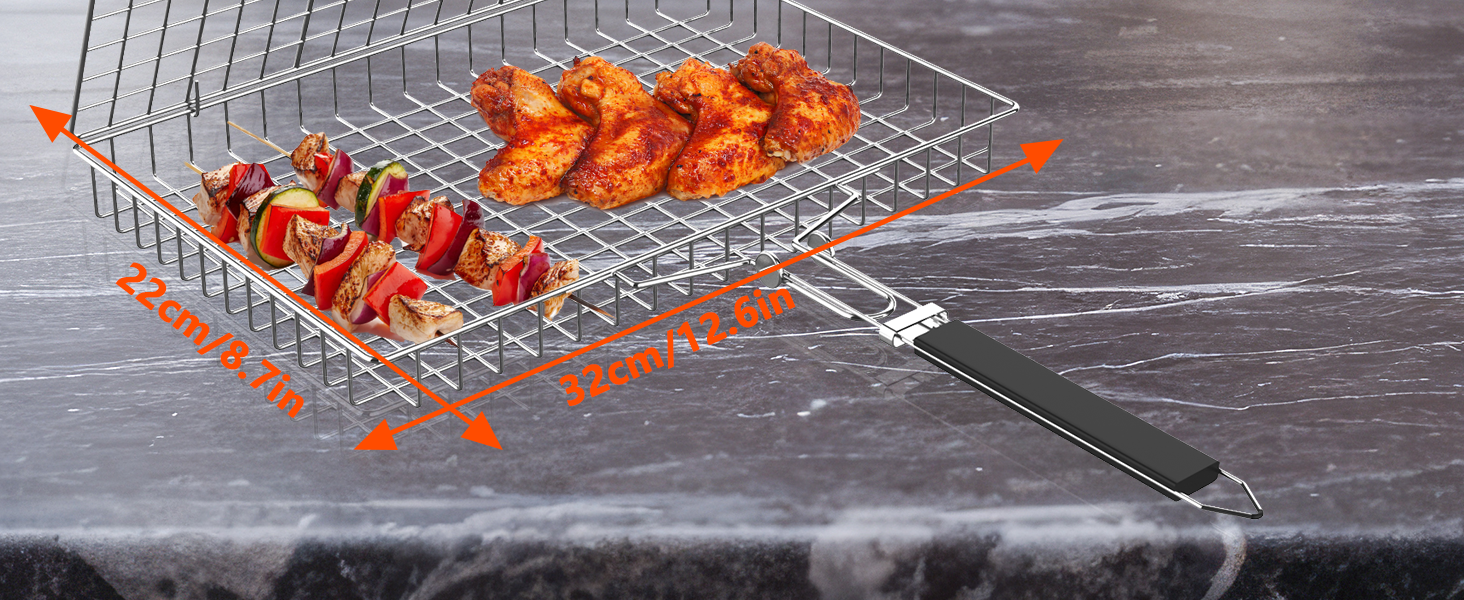 Wire mesh grilling basket with handles, containing cooked shrimp or prawns, positioned on a dark stone or marble surface.