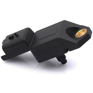 Black plastic device with angular design, featuring a circular opening and protruding elements. Appears to be an automotive or electronic component.