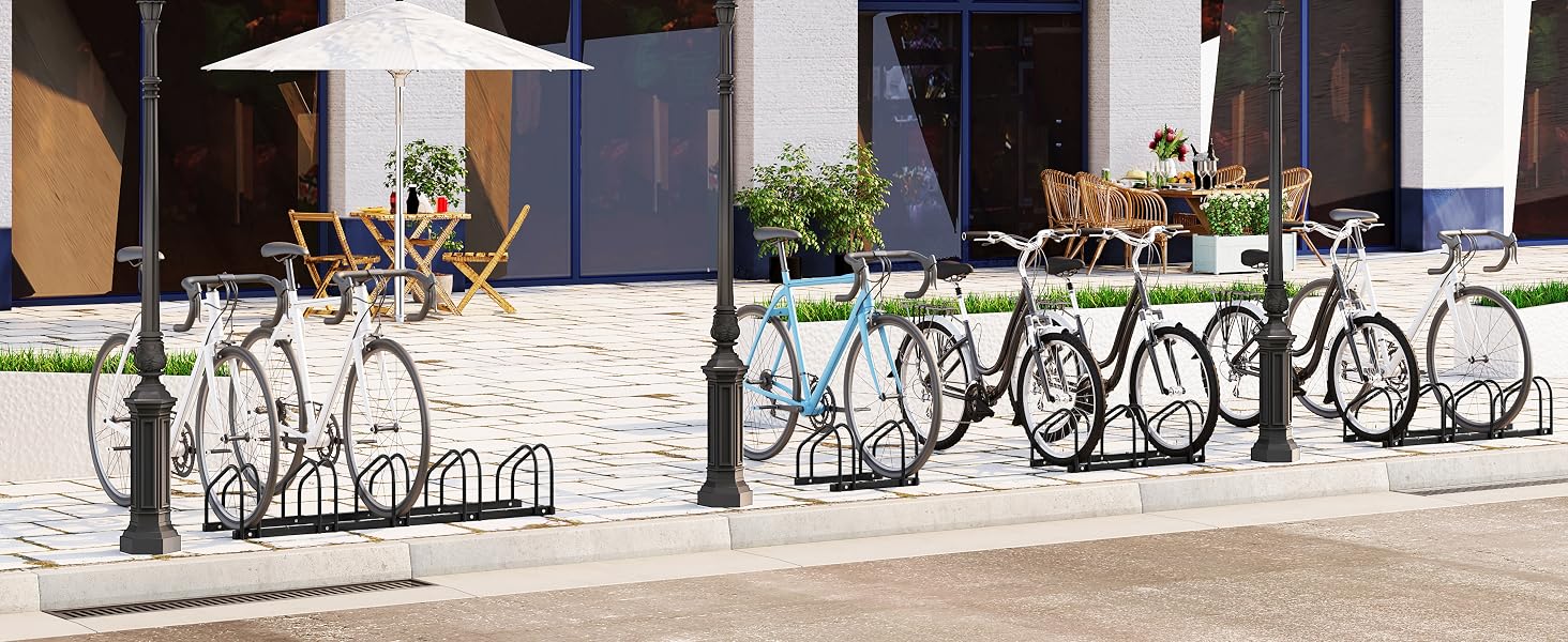 a couple of bicycles parked on a sidewalk.
