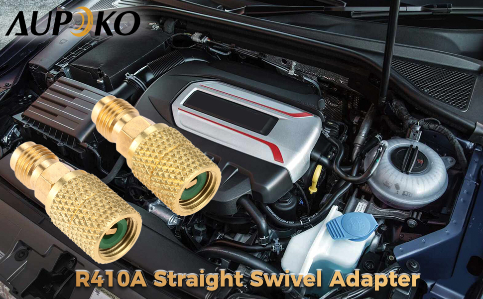 Two gold-colored R410A straight swivel adapters displayed in front of a car engine compartment. Brand name 'AUPOKO' visible in the top left corner.