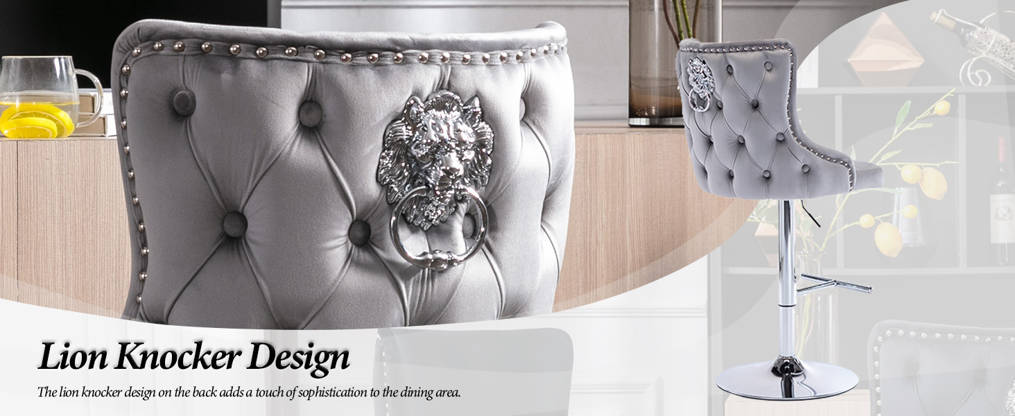 Gray tufted bar stool with button detailing and silver lion head knocker on backrest. Chrome base visible. Additional stool shown in background.