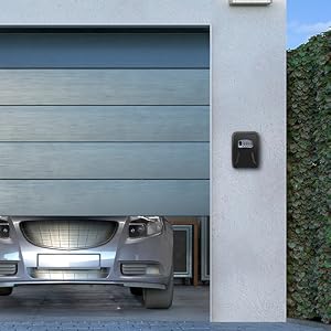 Garage interior with partially open door, showing front of parked car. Black keypad mounted on exterior wall.