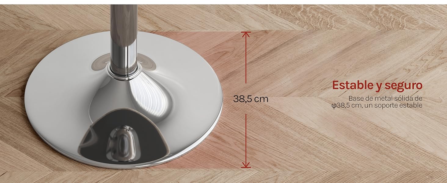 El texto dice «38,5 cm» y «Estable y seguro». Base cromada con medición de altura que muestra un soporte circular de metal con poste central sobre suelo de madera.
