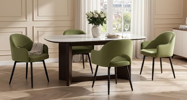 Modern dining set featuring dark wooden table surrounded by four olive green upholstered chairs with curved backs and black metal legs in elegant room setting.
