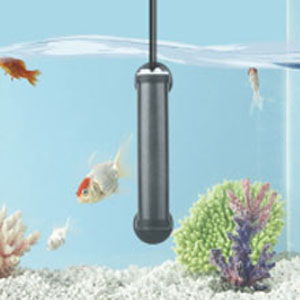 Cylindrical aquarium heater submerged in fish tank with tropical fish swimming nearby. Heater attached to tank wall.