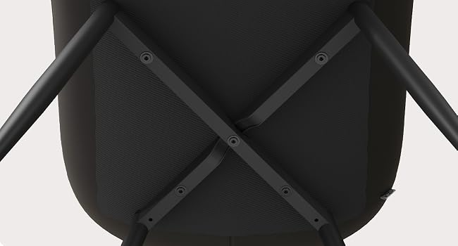 Close-up view of black quilted or padded surface with cross-stitched pattern and visible stitching details.