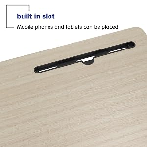 Built-in slot feature on wooden surface showing a black mounting strip for holding mobile phones and tablets.