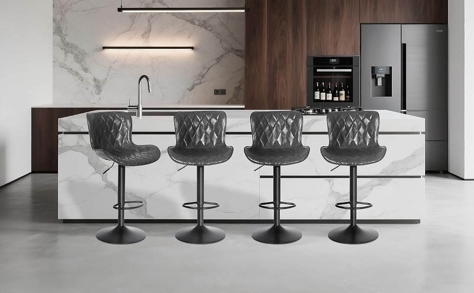 Row of modern black adjustable bar stools arranged in line against a white counter or bar surface.